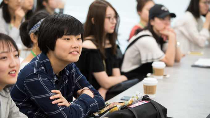 Group of international students listening in a classroom